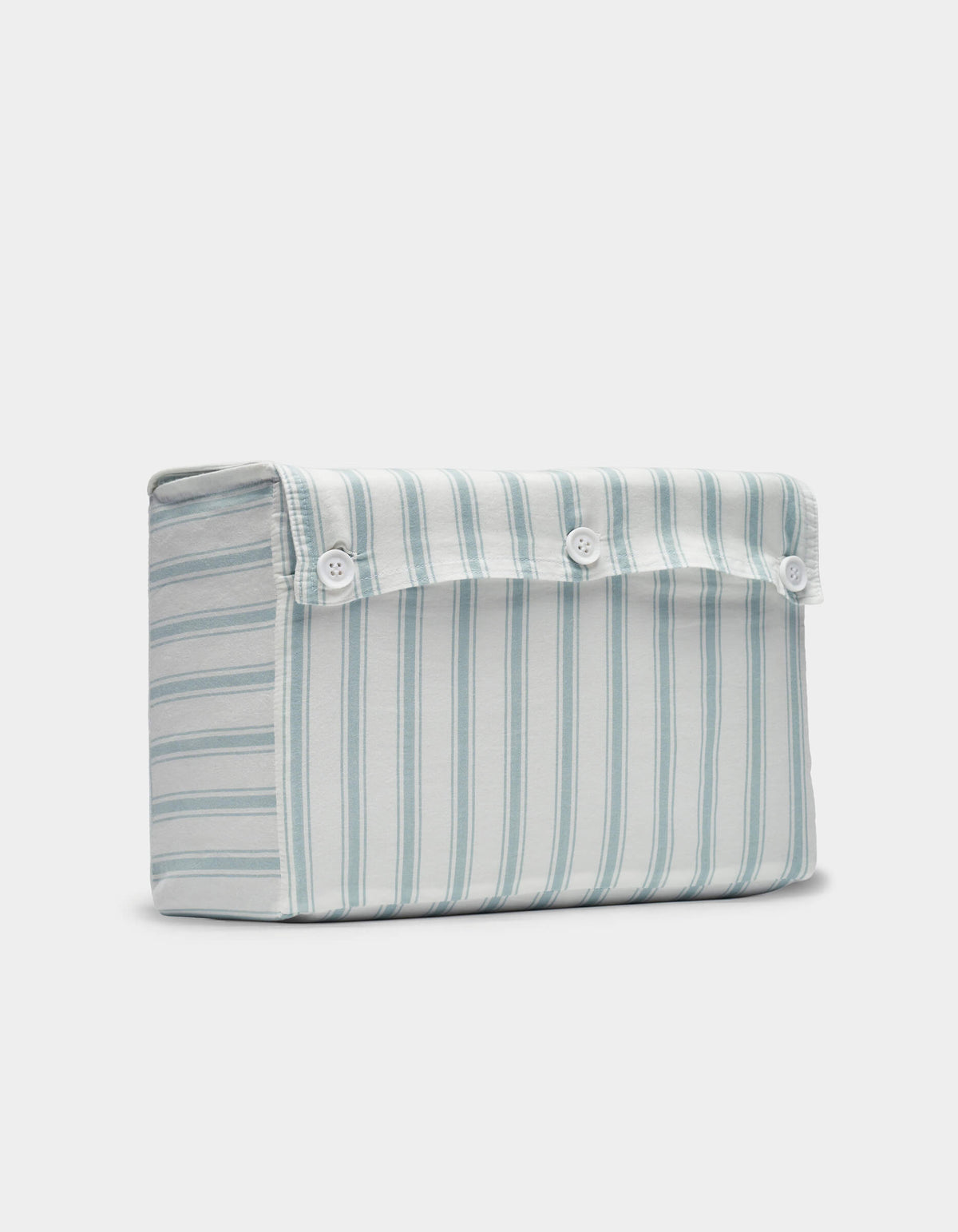 The Cozy Earth Soft-Wash Cotton Sheet Set features a rectangular pouch with light blue and white stripes and three white buttons on the top flap for closure.