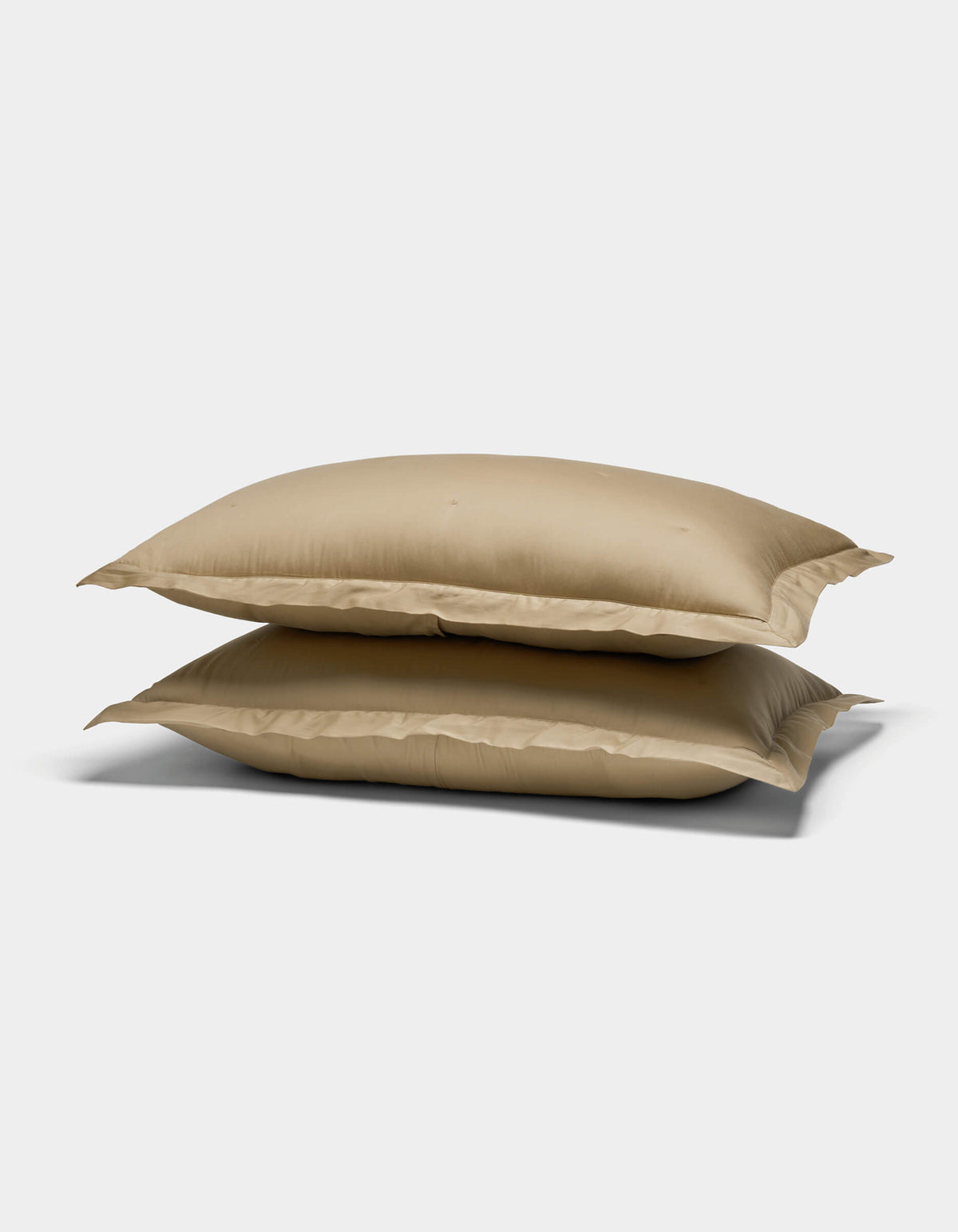 Two Cozy Earth Soft-Wash Cotton Quilted Shams, in beige, are stacked on top of each other against a plain white background.|Color:Sandalwood