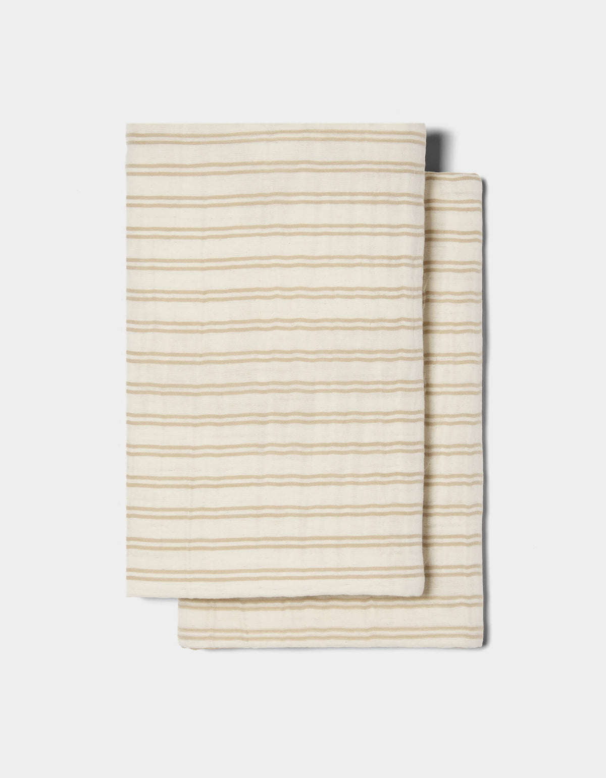Two Waterfront Shams by Cozy Earth, cream-colored with thin horizontal beige stripes, are stacked on a white background.