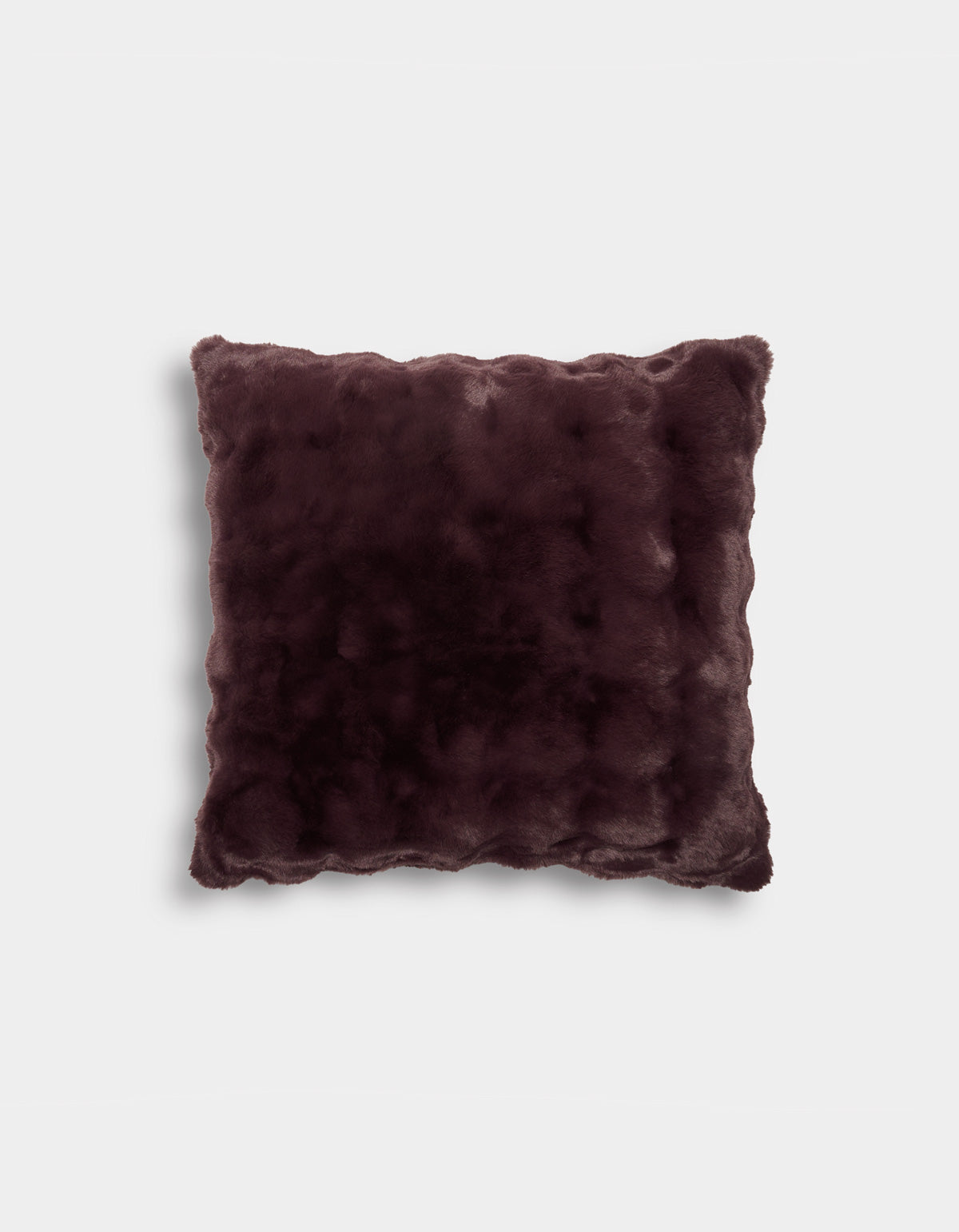 A square Bubble Cuddle Pillow by Cozy Earth, featuring a plush, velvety soft dark brown fabric with wavy edges, displayed against a plain white background.|Color:Raisin |Size:24" x 24"