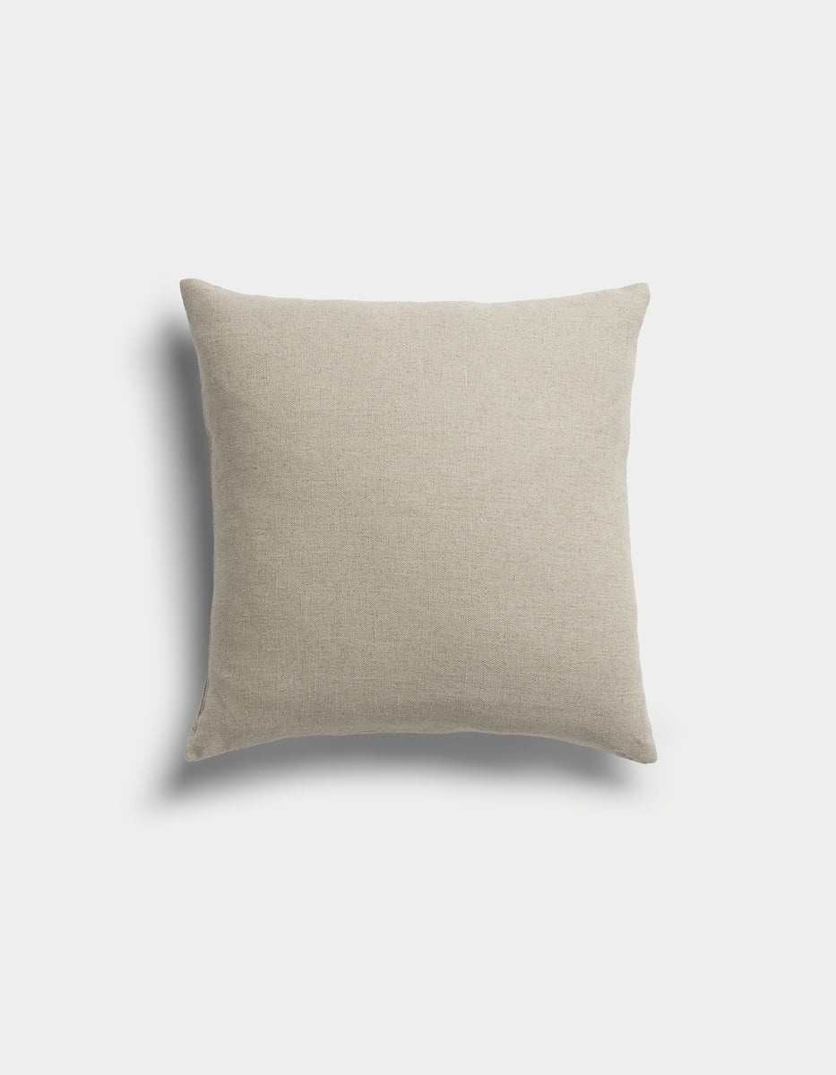 The Sonoma Throw Pillow by Cozy Earth is a square, beige pillow with a soft fabric texture, displayed against a light gray background with a faint shadow on the left side.|Color:Tallow|Size:20" x 20"