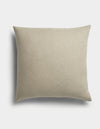 The Sonoma Throw Pillow by Cozy Earth is a square, beige cushion featuring a plain fabric texture, displayed against a white background with a soft shadow to the left.|Color:Tallow |Size:26" x 26"