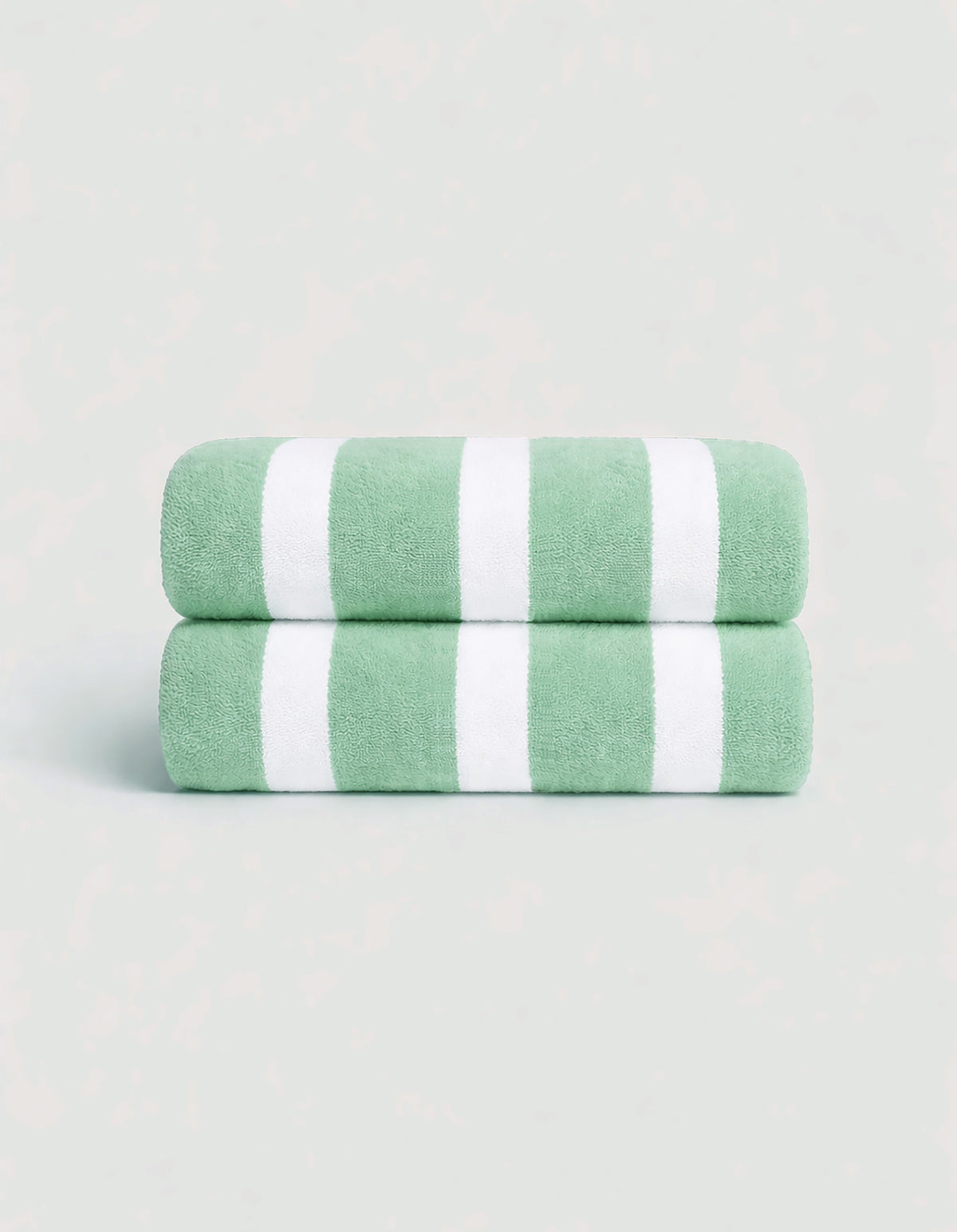 The Cozy Earth Classic Stripe Resort Towel Bundle features two neatly folded towels with wide green and white stripes, stacked together against a light background.|Color:Julep