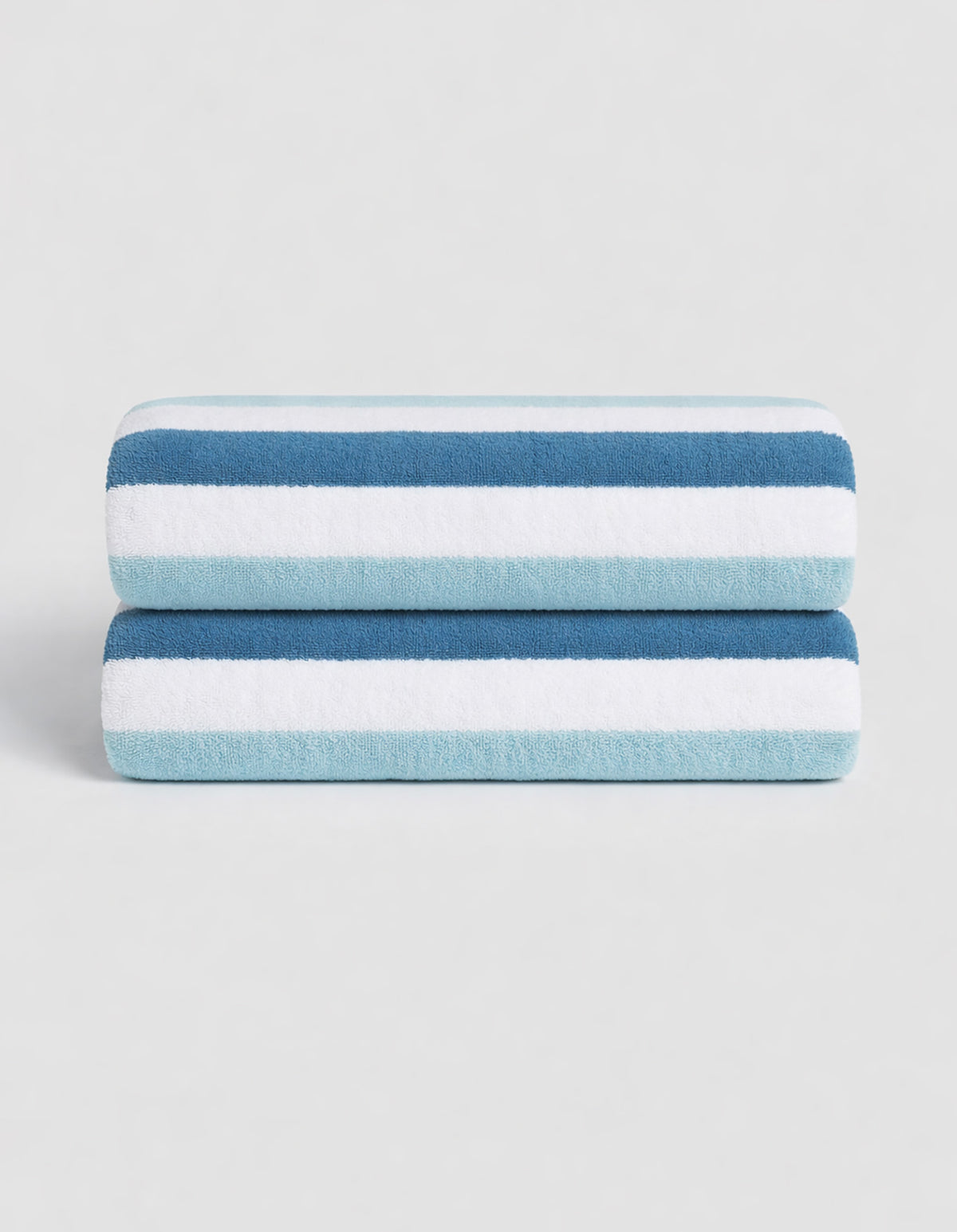The Classic Stripe Resort Towel Bundle by Cozy Earth features two neatly folded towels with dark blue, light blue, and white stripes, stacked together against a plain light background.|Color:Lake Stripe