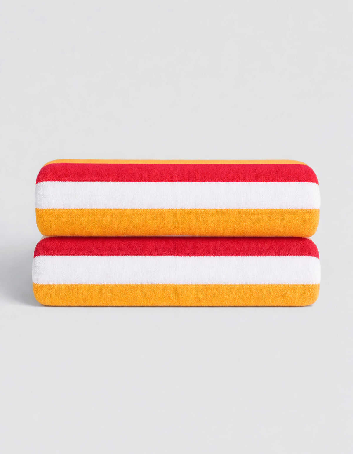 The Classic Stripe Resort Towel Bundle by Cozy Earth features two neatly folded towels with bold red, white, and yellow stripes, stacked on a simple light gray background.|Color:Mandarin Stripe