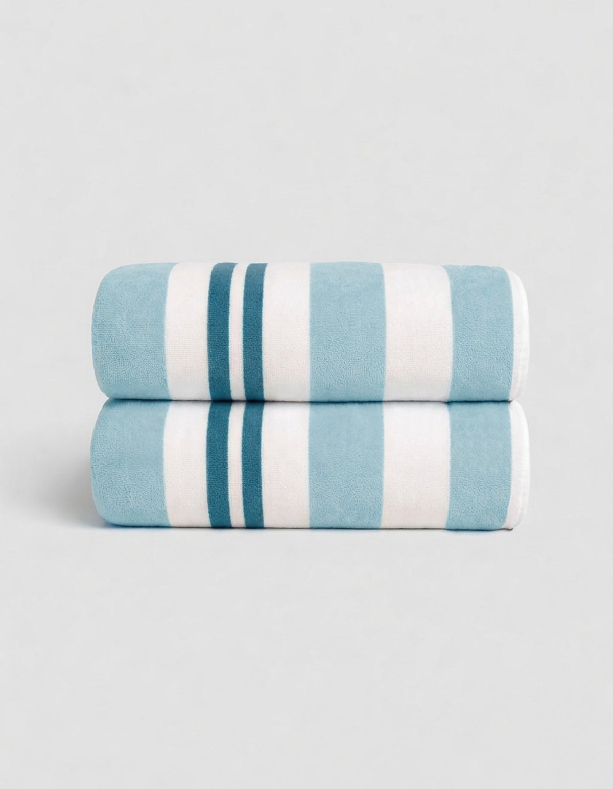 The Cozy Earth Classic Stripe Resort Towel Bundle in Wave Stripe features two neatly folded towels, stacked together, with bold blue and white stripes against a simple light background.