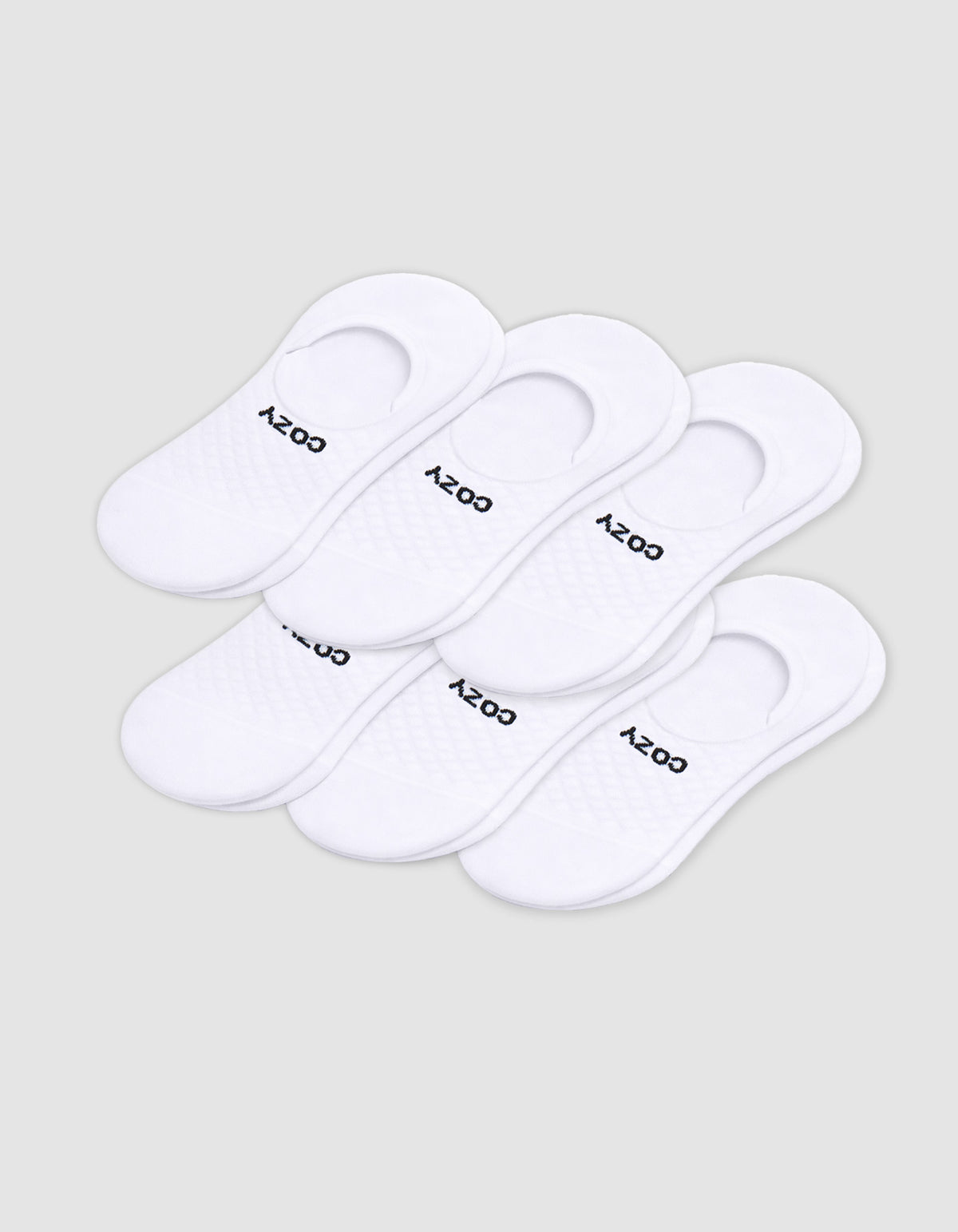 Six pairs of Cozy Earth Men's Essential No-Show Socks are stacked on a plain white background, each featuring "COZY" printed in black near the heel opening.