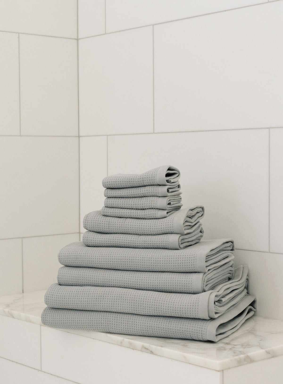 Complete Waffle Bath Bundle in the color Harbor Mist. Photo of Harbor Mist Complete Waffle Bath Bundle taken resting on a marble counter top. |Color:Harbor Mist