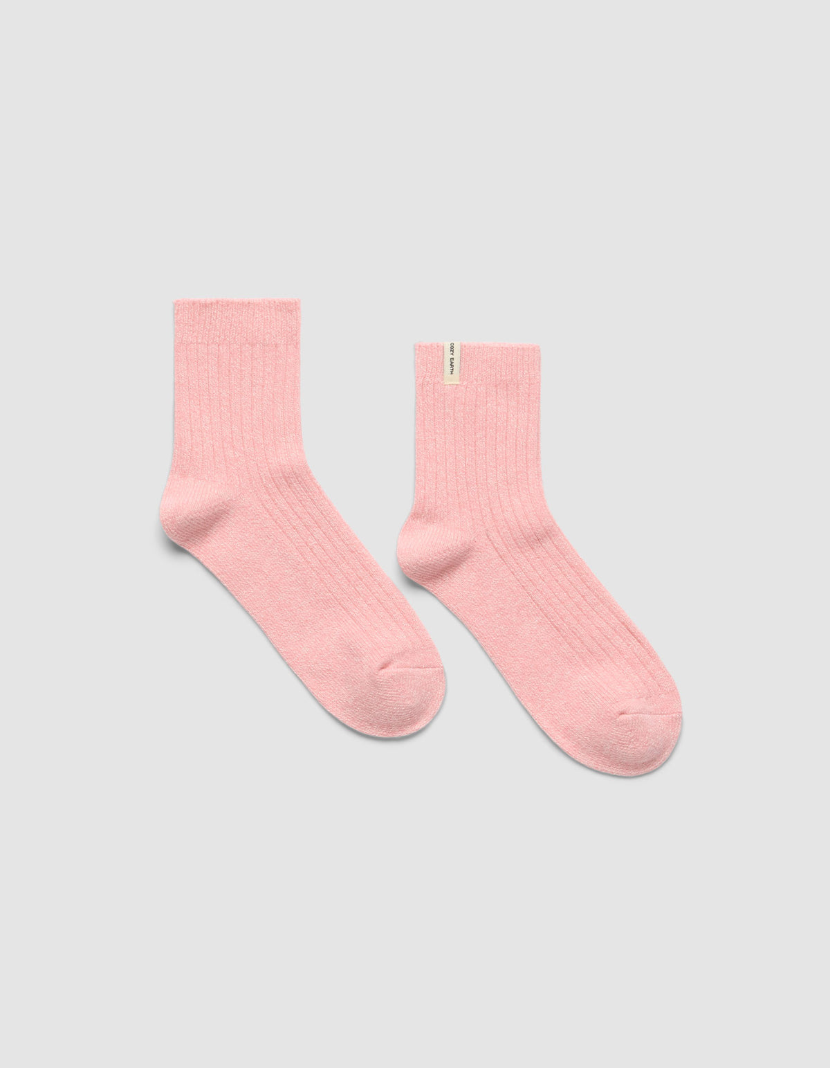 A pair of The Plush Modern Crew Sock in pink by Cozy Earth.