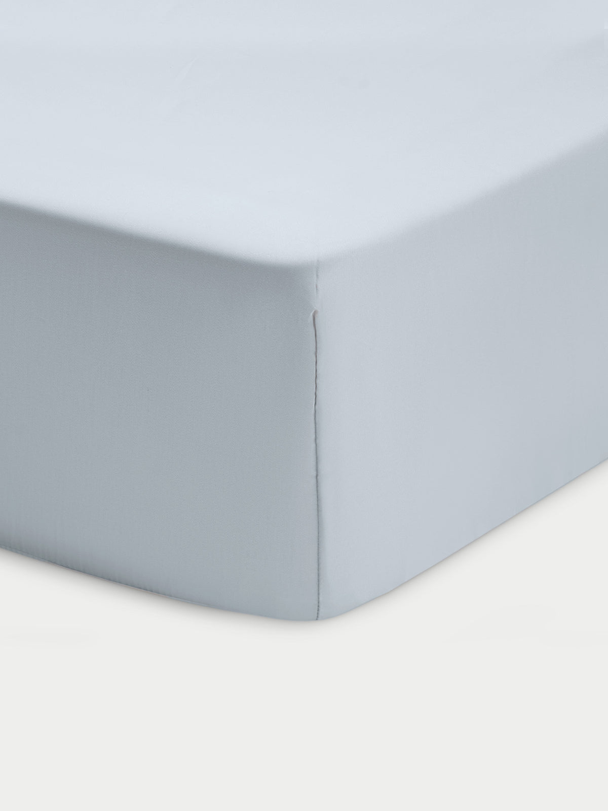 Corner of shore crib sheet with white background 