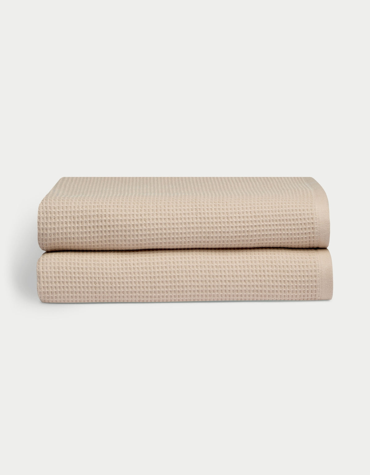 Waffle Bath Sheets in the color sand. Photo of Waffle Bath Sheets taken with white a background. 