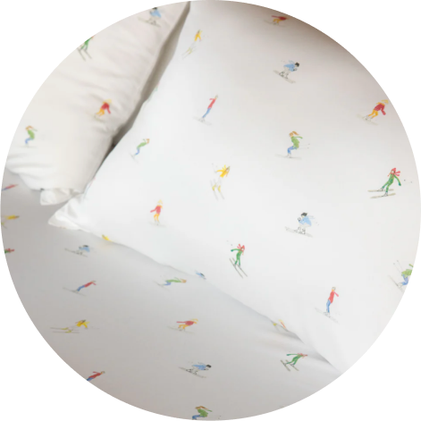 A swatch of Cozy Earth Bamboo Sheets with Skiers print is pictured.