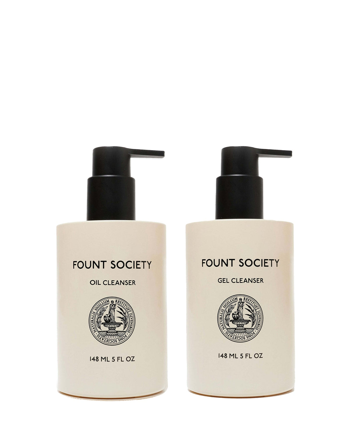 Two beige pump bottles from Cozy Earth’s Double Cleanse Duo—Oil Cleanser on the left, Gel Cleanser on the right—feature black pumps, black text, round front emblems, and each holds 148 mL (5 fl oz).