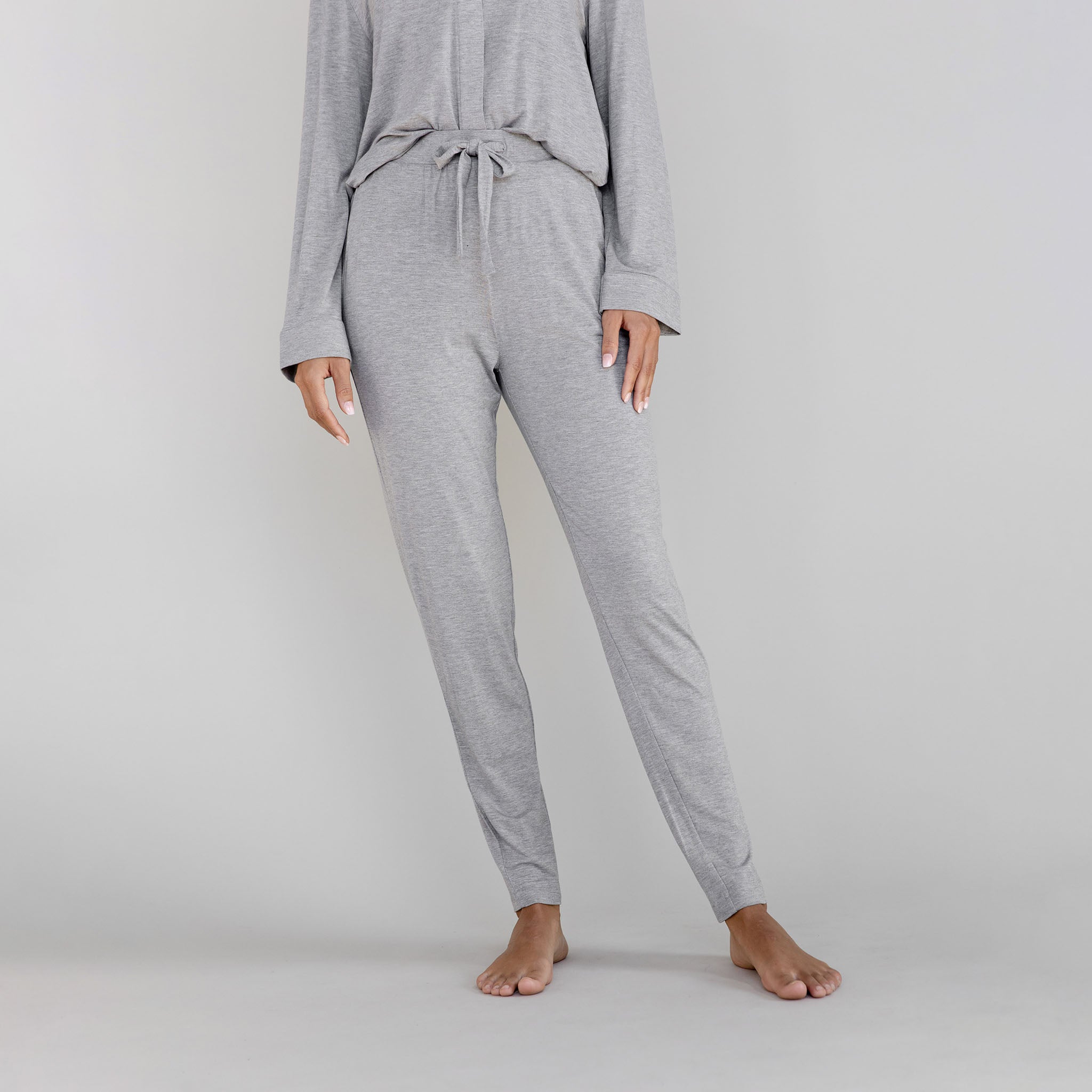 Gray pajama set worn by a person on a light gray background |Color:Heather Grey