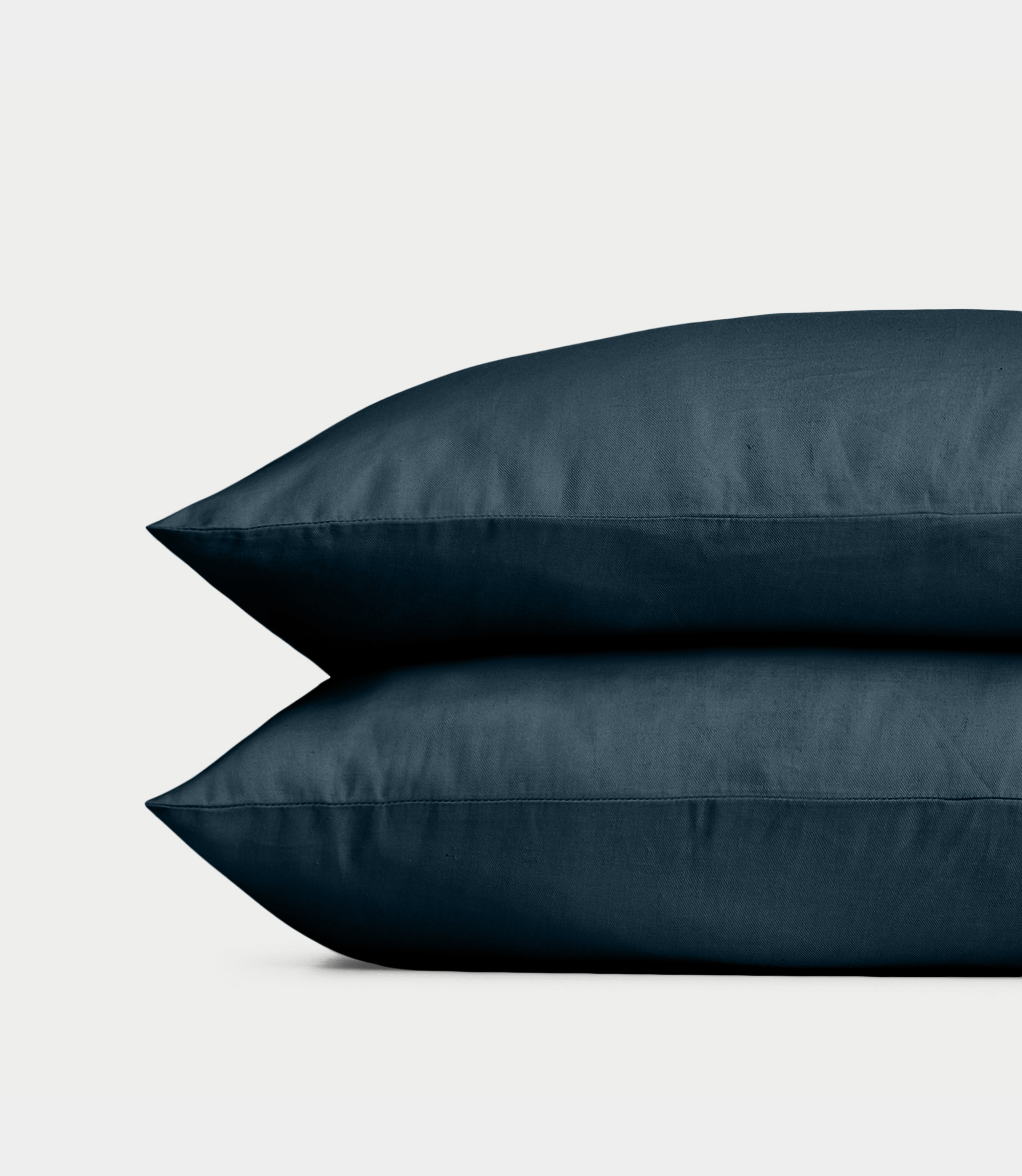Navy Linen Bamboo Pillow Shams photographed over a white background. |Color: Navy