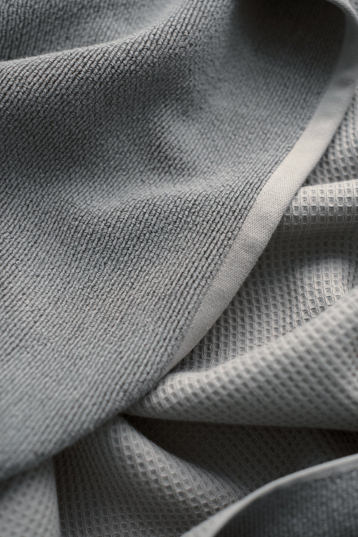 Waffle Bath Towel in the color Charcoal. Photo of Charcoal Waffle Bath Towel taken close up showing only the Charcoal. |Color:Charcoal